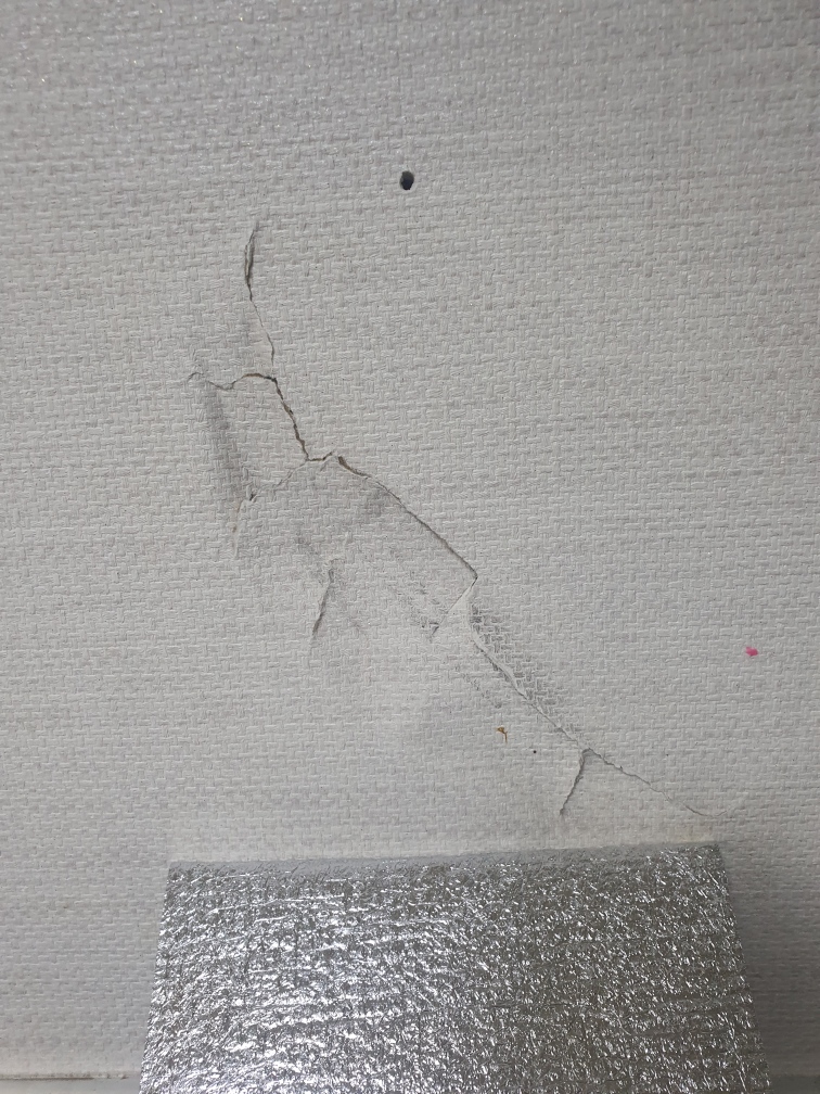 Cracked drywall before repair in a Korean apartment