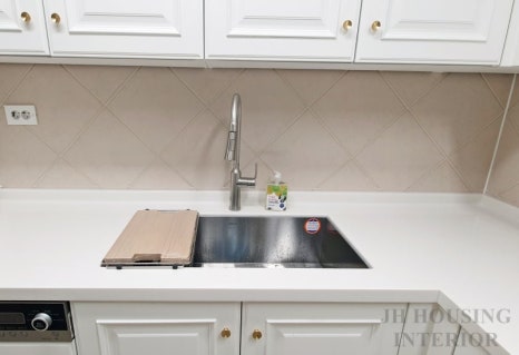 Large rectangular kitchen sink with high-arc faucet in Korea