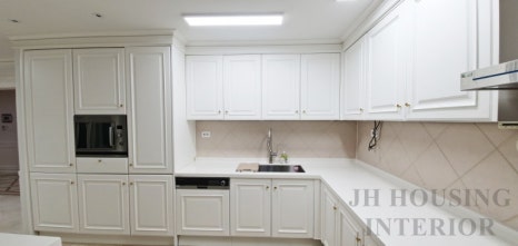 Renovated white kitchen in a large Korean apartment